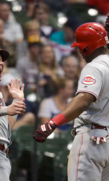 Reds withstand another homer by Yelich, beat Brewers 11-7